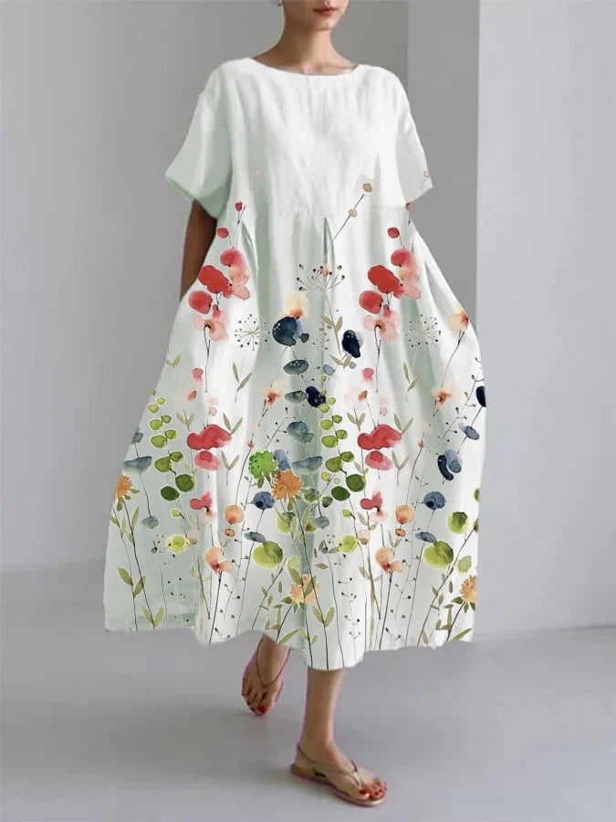 Esmee | Zomerse bloemenjurk met relaxte pasvorm en elegante flair.