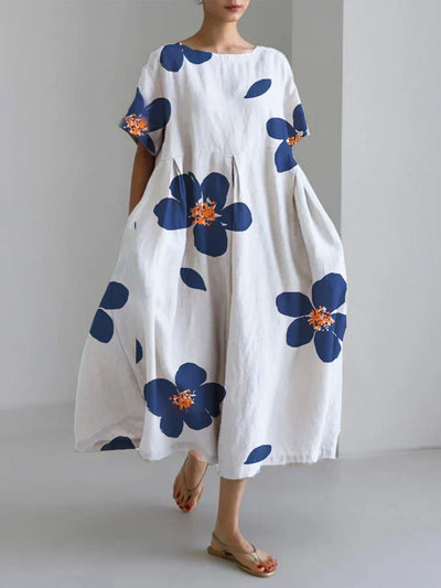 Jasmijn | Luchtige bloemenjurk met chique accenten – ideaal voor zomerse flair.